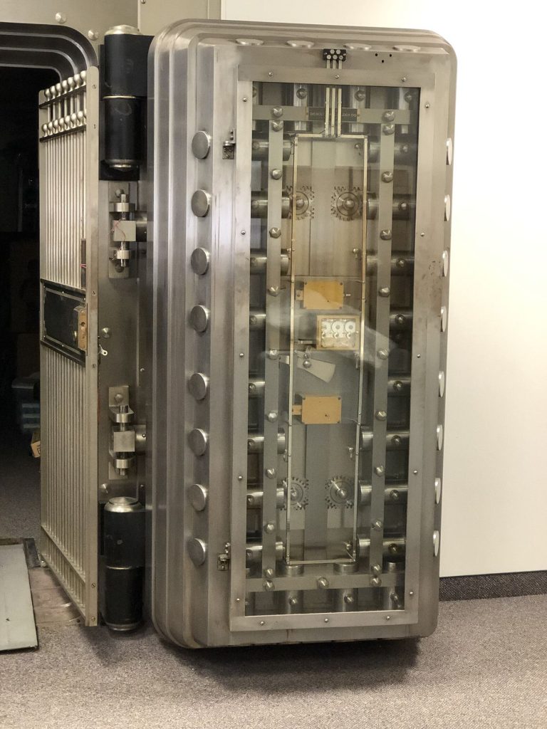 Multi-Signature Vaults Bring Stronger Custody to Smaller Firms heavy secure vault door with digital security technology